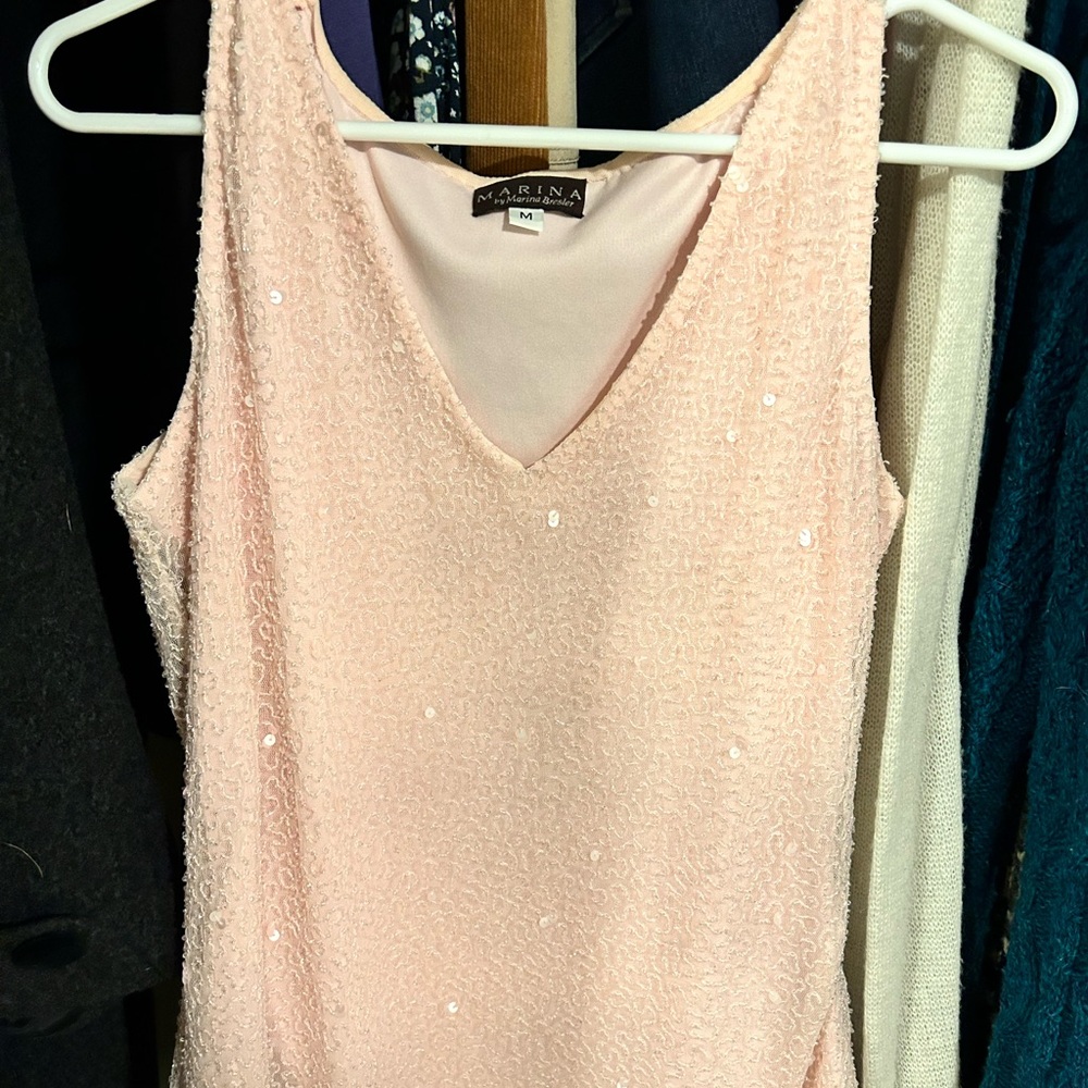 Pale pink beaded sleeveless top to wear for a formal evening